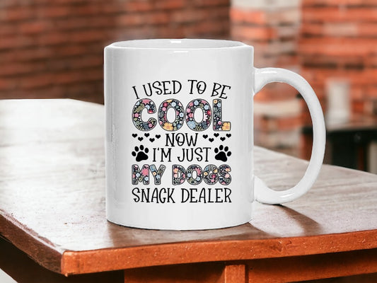 I used to be cool, now I’m just my dogs snack dealer, 11 oz ceramic mug